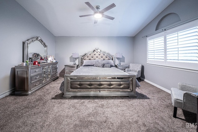 carpeted bedroom featuring ceiling fan and vaulted ceiling