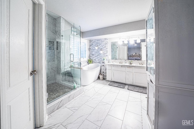 bathroom with vanity and independent shower and bath