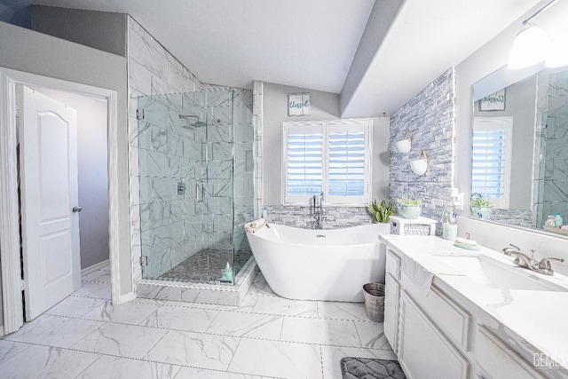 bathroom featuring plus walk in shower, vanity, and lofted ceiling