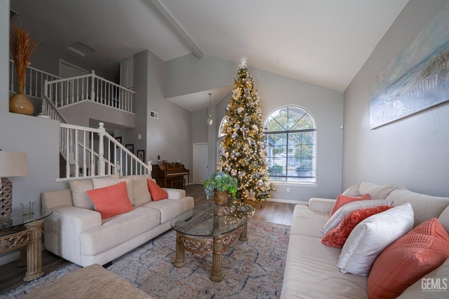 living room featuring hardwood / wood-style flooring and lofted ceiling with beams