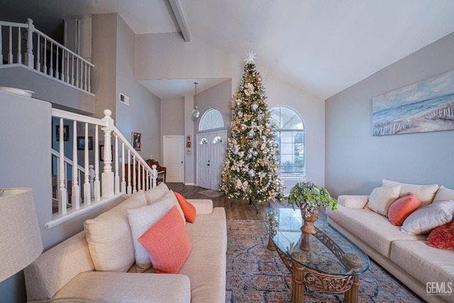 living room with hardwood / wood-style floors, high vaulted ceiling, and beamed ceiling