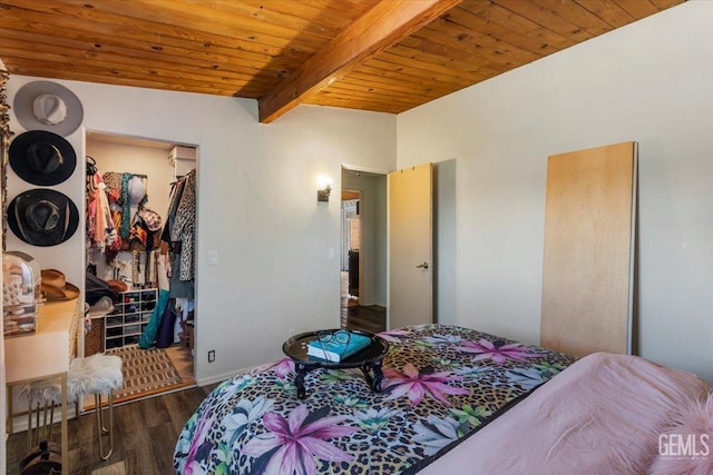 bedroom featuring dark wood-type flooring, wood ceiling, a spacious closet, a closet, and beam ceiling