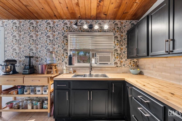 kitchen with sink, wooden counters, wooden ceiling, tile patterned flooring, and backsplash