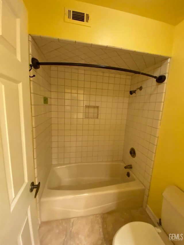 bathroom featuring toilet, tile patterned flooring, bathtub / shower combination, and visible vents