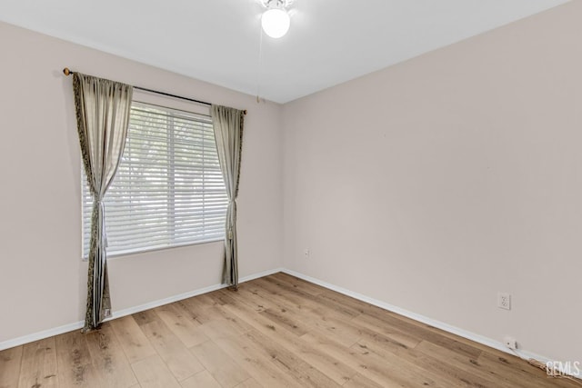 spare room featuring light hardwood / wood-style floors