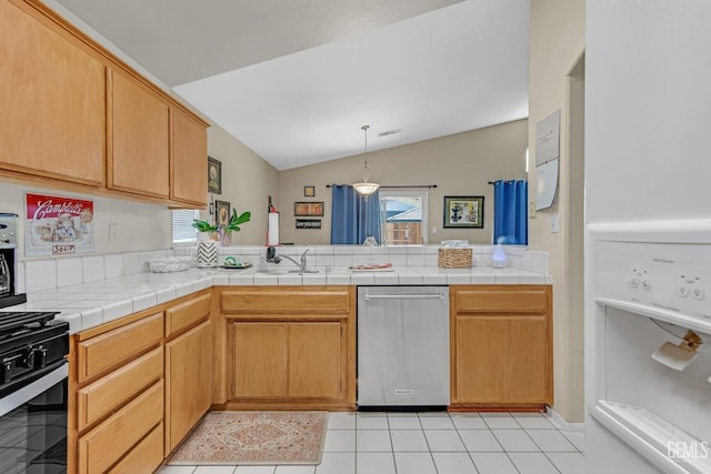 kitchen featuring tile countertops, a wealth of natural light, black range oven, and lofted ceiling