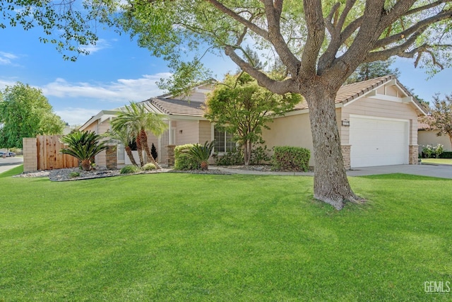 view of front of house featuring a front yard and a garage