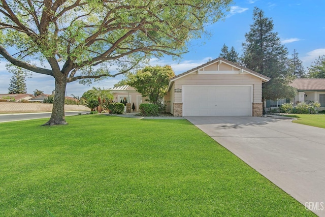 view of front of property with a garage and a front lawn