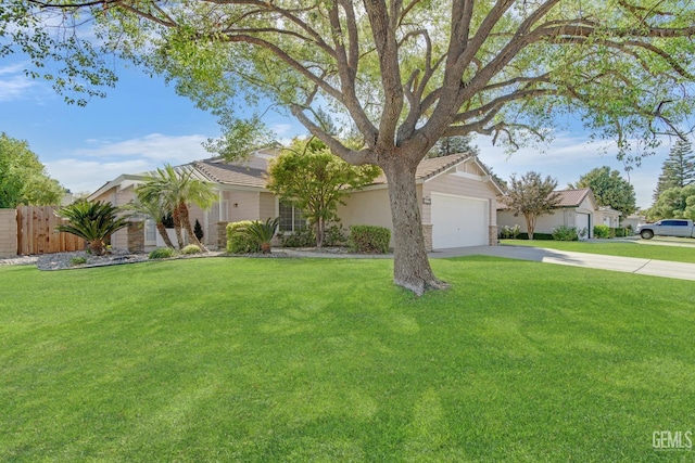 view of front of house with a front yard and a garage