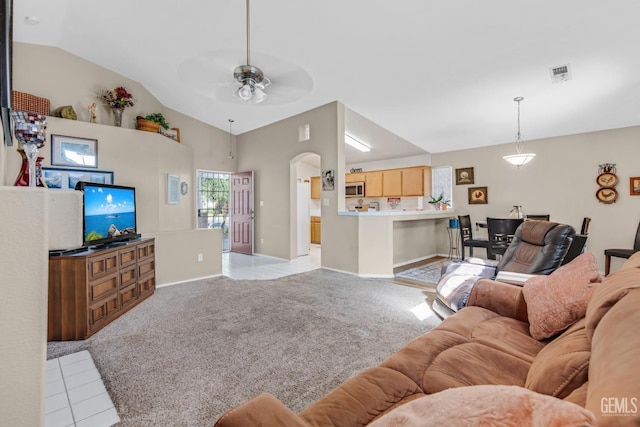 carpeted living room with ceiling fan and lofted ceiling