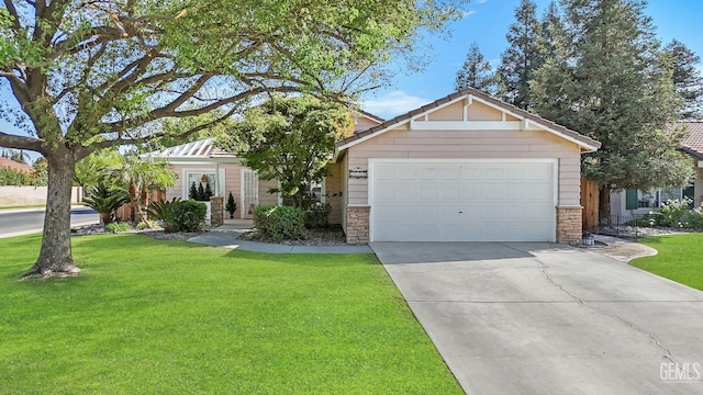 view of front of house with a front lawn and a garage