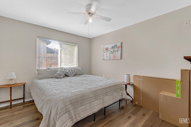 bedroom featuring ceiling fan and light hardwood / wood-style floors