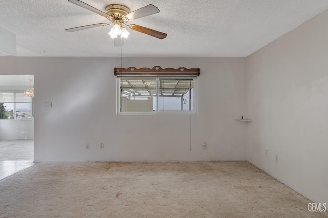 726 D St, Taft, CA 93268 - empty room featuring plenty of natural light, a textured ceiling, and carpet
