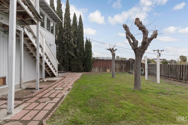 726 D St, Taft, CA 93268 - view of yard featuring fence and stairs