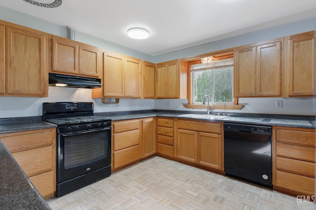 726 D St, Taft, CA 93268 - kitchen with black appliances, under cabinet range hood, a sink, and dark countertops