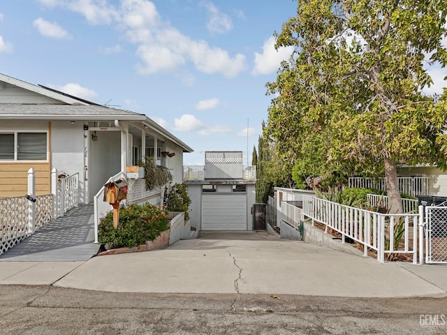 726 D St, Taft, CA 93268 - view of front facade with a garage, stucco siding, concrete driveway, and fence
