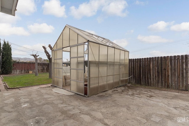 726 D St, Taft, CA 93268 - view of greenhouse featuring a lawn and a fenced backyard