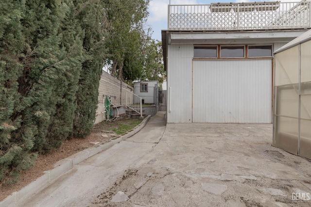 726 D St, Taft, CA 93268 - view of home's exterior featuring an outdoor structure and fence