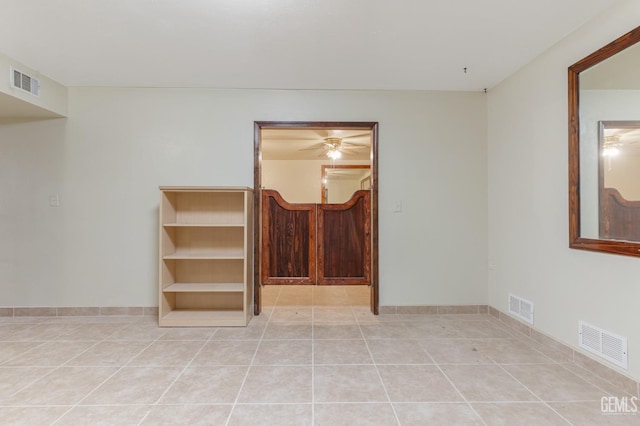 726 D St, Taft, CA 93268 - spare room with ceiling fan, visible vents, and light tile patterned floors