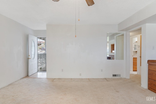 726 D St, Taft, CA 93268 - carpeted empty room with a textured ceiling, visible vents, and ceiling fan