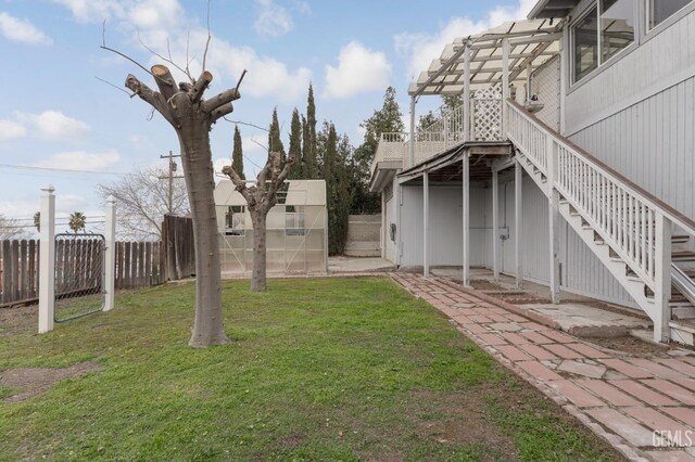 726 D St, Taft, CA 93268 - view of yard featuring a pergola, stairs, and fence