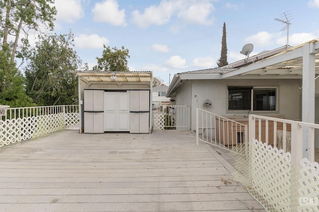 726 D St, Taft, CA 93268 - wooden terrace featuring a storage unit and an outbuilding