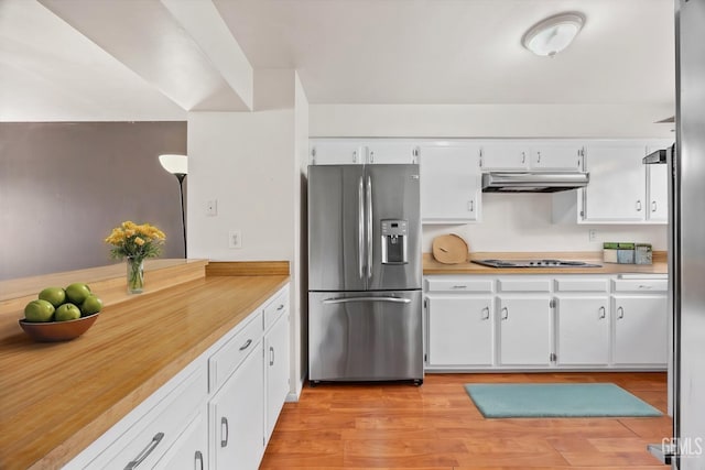 kitchen featuring appliances with stainless steel finishes, white cabinets, and light hardwood / wood-style floors