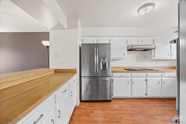 kitchen featuring appliances with stainless steel finishes, white cabinets, and light wood-type flooring