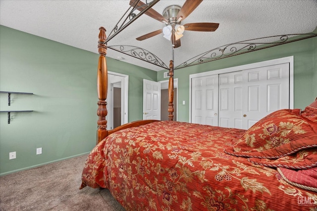 bedroom featuring lofted ceiling, ceiling fan, carpet, a textured ceiling, and a closet