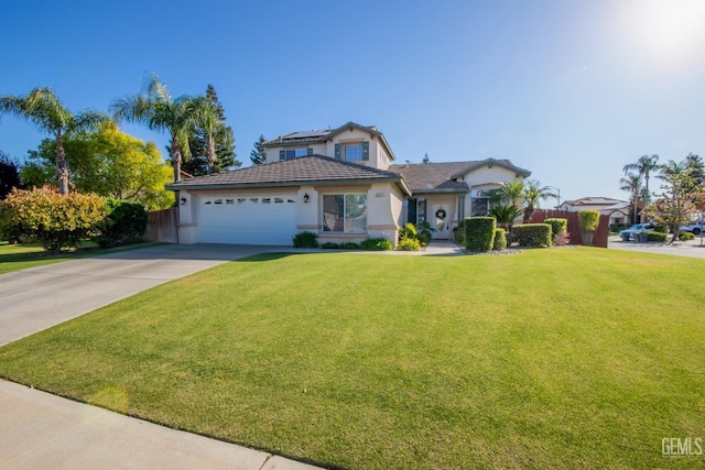 view of front facade with a garage and a front lawn