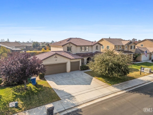 view of front of property featuring a garage and a front lawn