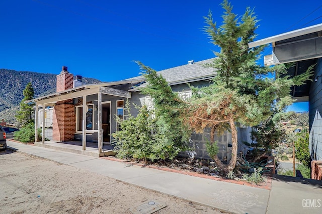 view of front of house with a mountain view