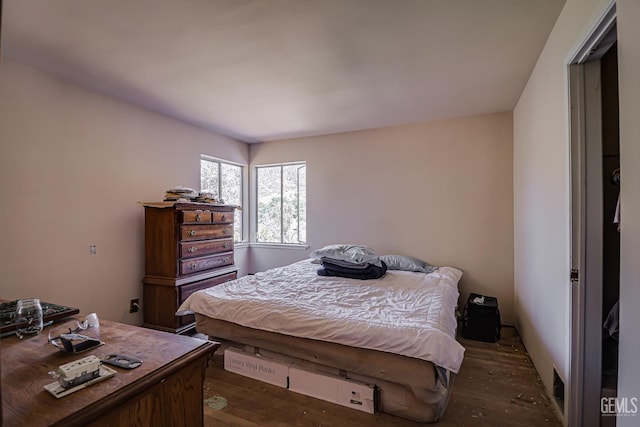 bedroom featuring dark hardwood / wood-style flooring