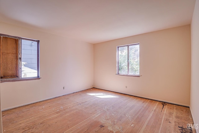 spare room featuring light hardwood / wood-style flooring