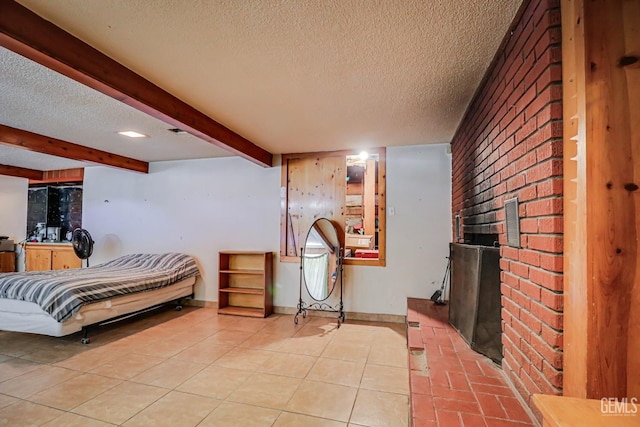 tiled bedroom with beamed ceiling and a textured ceiling