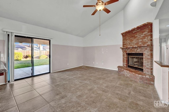 unfurnished living room featuring tile patterned floors, high vaulted ceiling, a ceiling fan, a fireplace, and baseboards