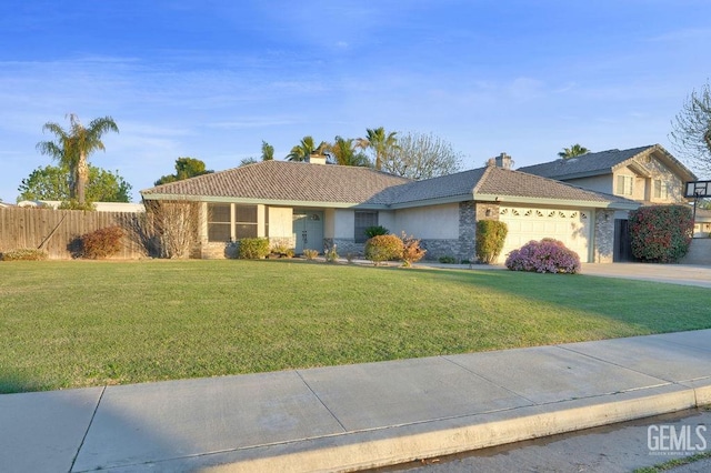 single story home with driveway, a chimney, an attached garage, fence, and a front lawn