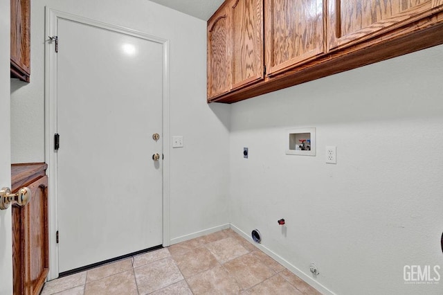 laundry room with hookup for an electric dryer, baseboards, gas dryer hookup, cabinet space, and hookup for a washing machine