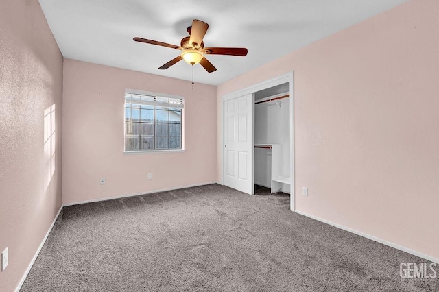 unfurnished bedroom with baseboards, a ceiling fan, a closet, and carpet