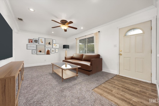 living room featuring visible vents, crown molding, baseboards, ceiling fan, and recessed lighting