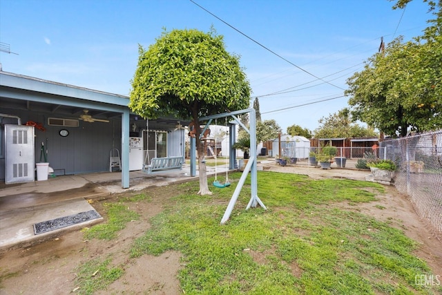 view of yard with a ceiling fan, a patio area, and fence