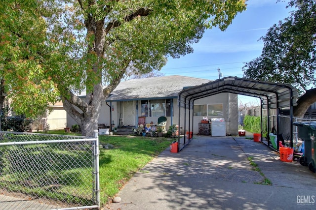 view of front of house with a carport, stucco siding, a front yard, and fence