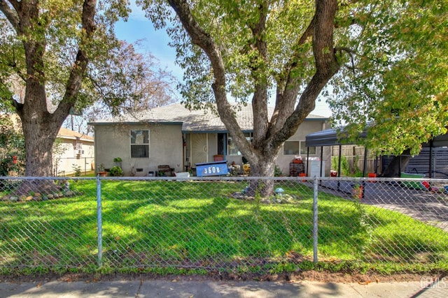 single story home featuring stucco siding, a front yard, and a fenced backyard