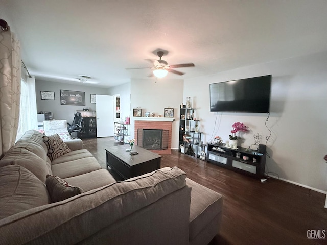 615 Cherokee Dr, Bakersfield, CA 93309 - living area with a ceiling fan, dark wood-style floors, and a brick fireplace