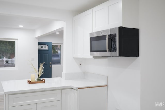 kitchen featuring white cabinetry