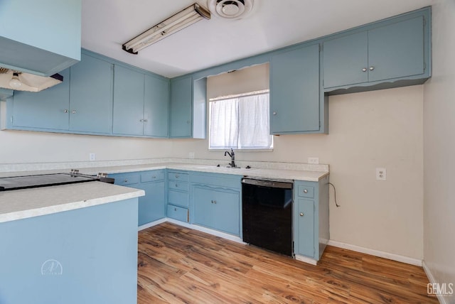 728 D St, Taft, CA 93268 - kitchen featuring dishwasher, blue cabinetry, light wood-style floors, and a sink