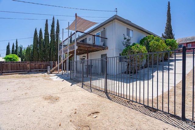 728 D St, Taft, CA 93268 - view of front of home with stairway and a deck