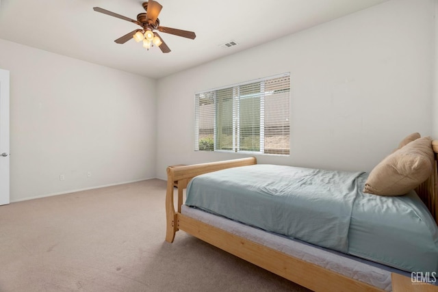 bedroom with baseboards, ceiling fan, visible vents, and carpet floors
