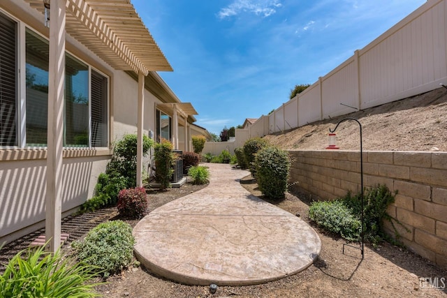 view of yard with a fenced backyard and a patio area