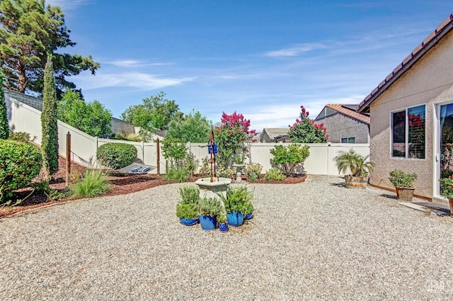 14030 Sandstone Peak Dr, Bakersfield, CA 93306 - fenced backyard featuring a patio